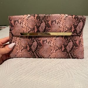 Pink faux snake clutch